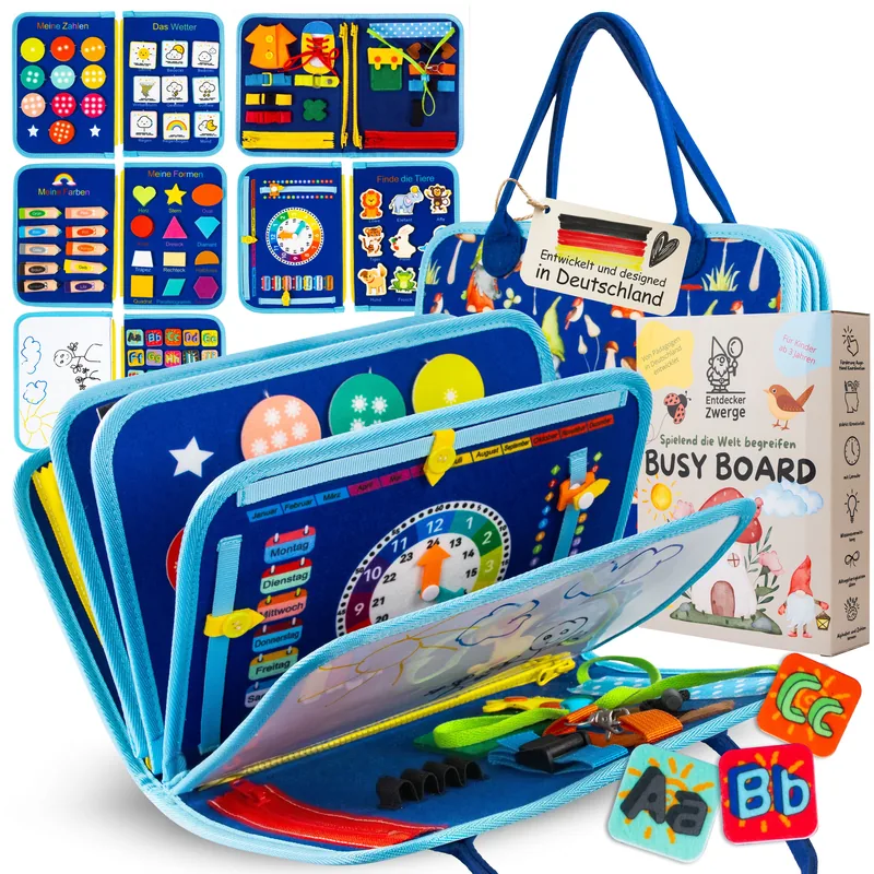 Das Busy Board von Entdecker-Zwerge: aufgeklappt mit Lernuhr, Zahlen- und Buchstabenseiten, daneben die Geschenkbox